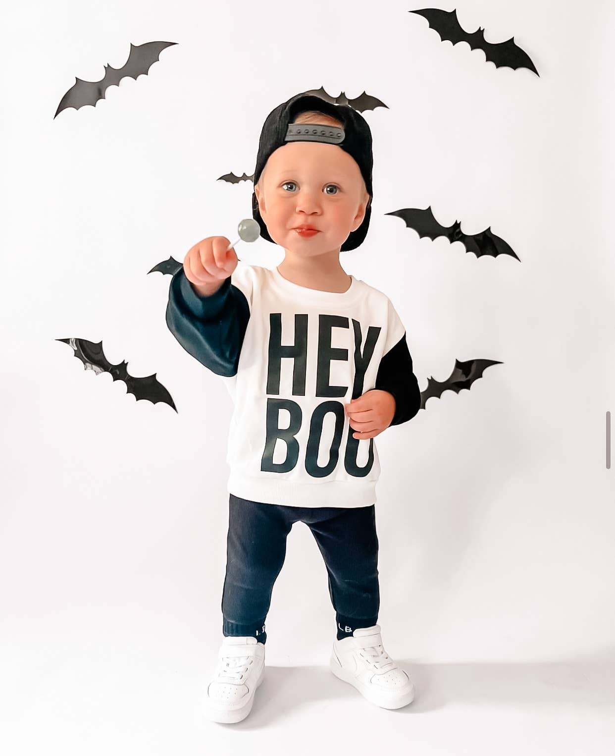 Hey Boo Halloween sweatshirt for kids with playful design, ideal for Halloween celebrations.