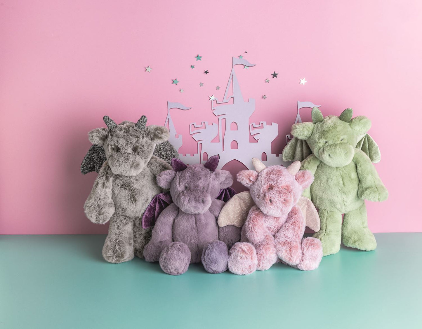 Seated dragon plushies full length view