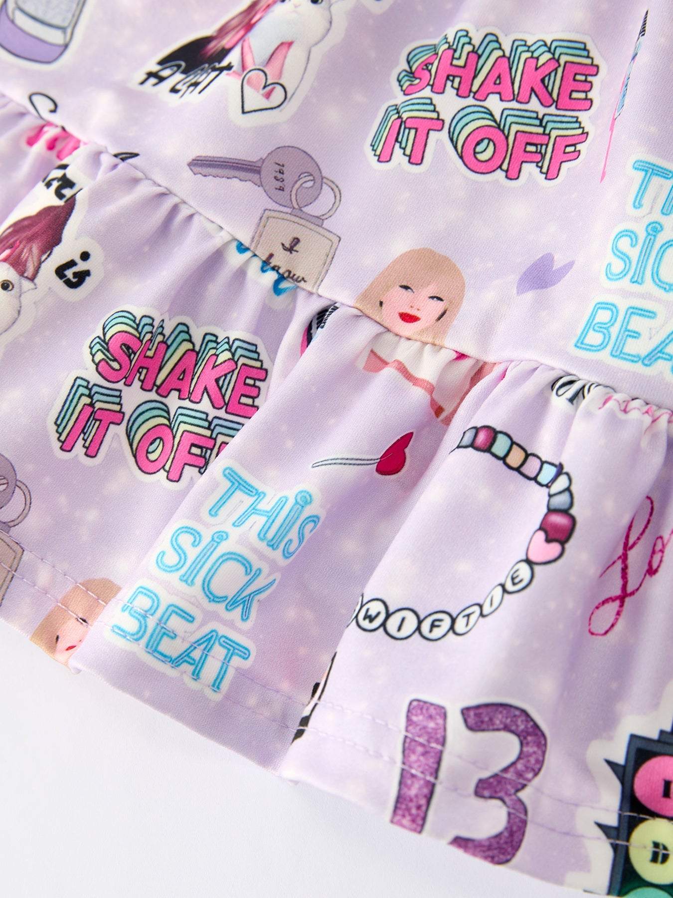 Purple TS Print Ruffle Sleeve Top and Leggings Girls Set outfit fabric and material close-up