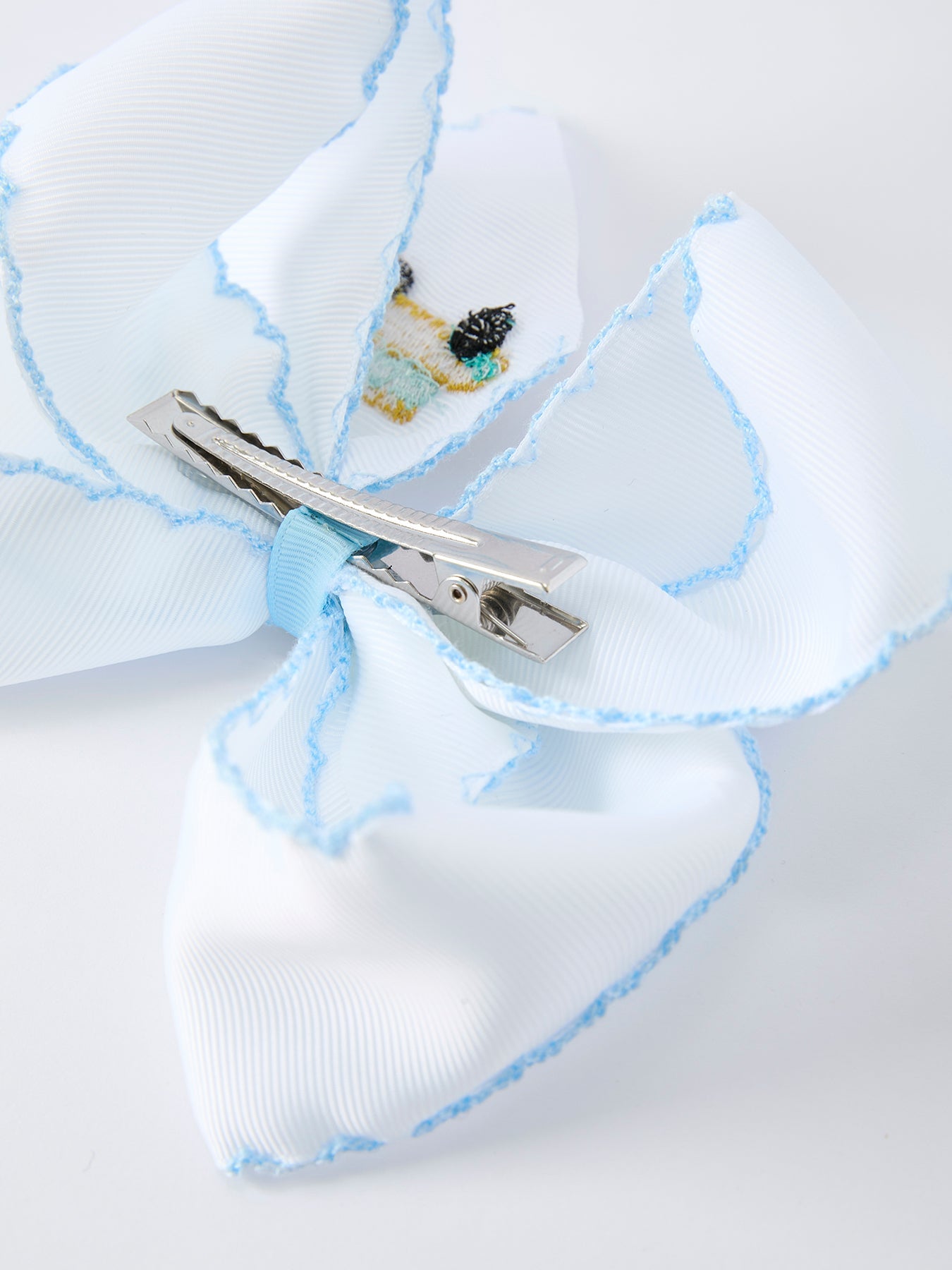Back-to-school truck bow hair accessory stitching detail