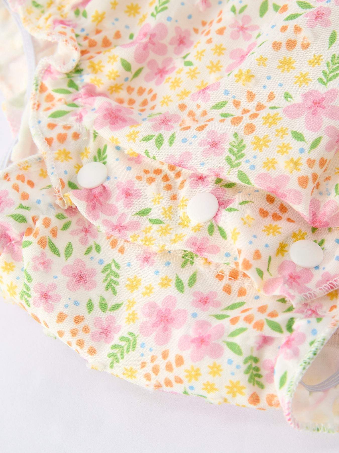Floral Girls Smocked Ruffle Romper fabric and material close-up