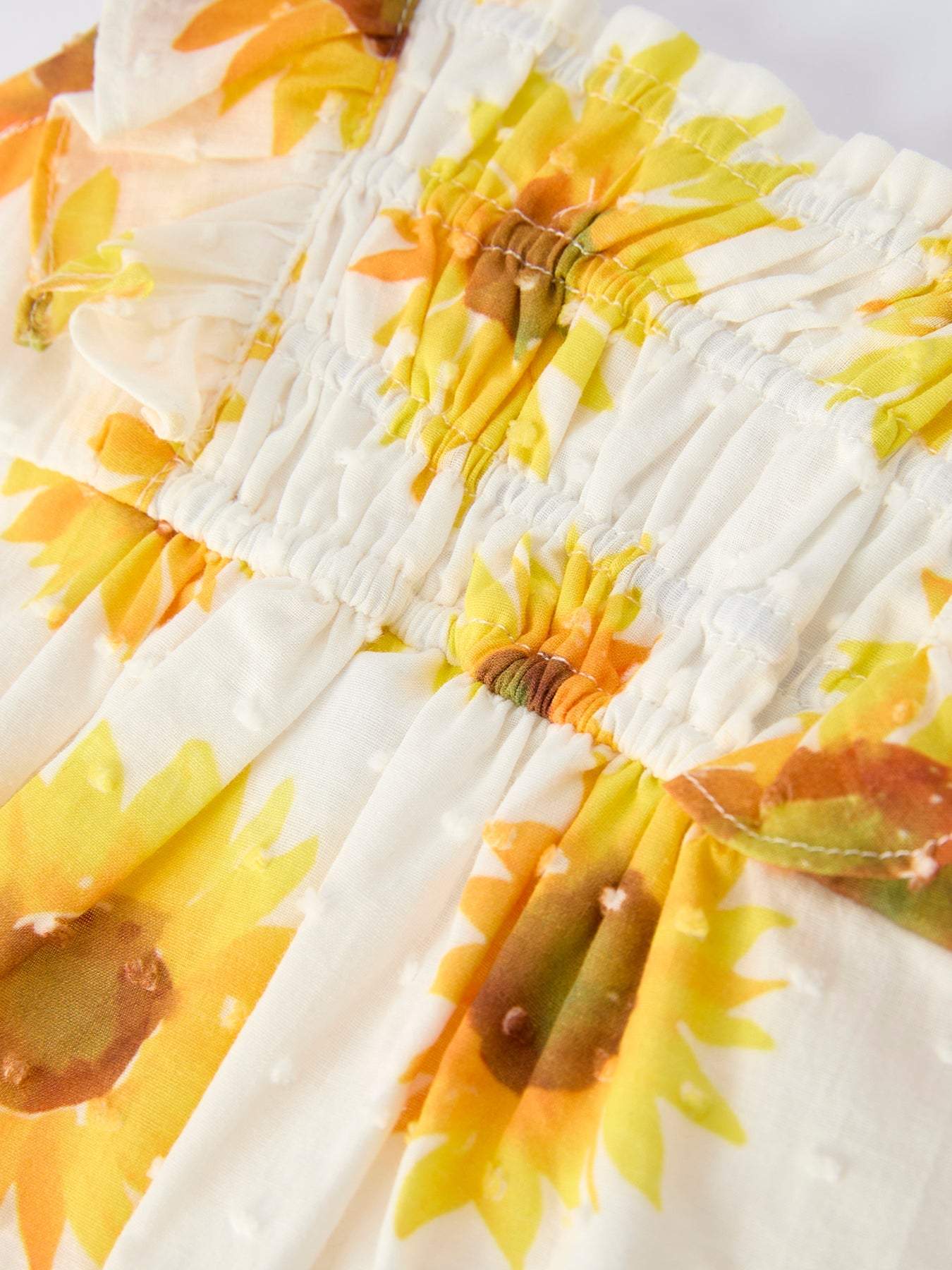 Sunflower Girls Smocked Ruffle Romper fabric and material close-up