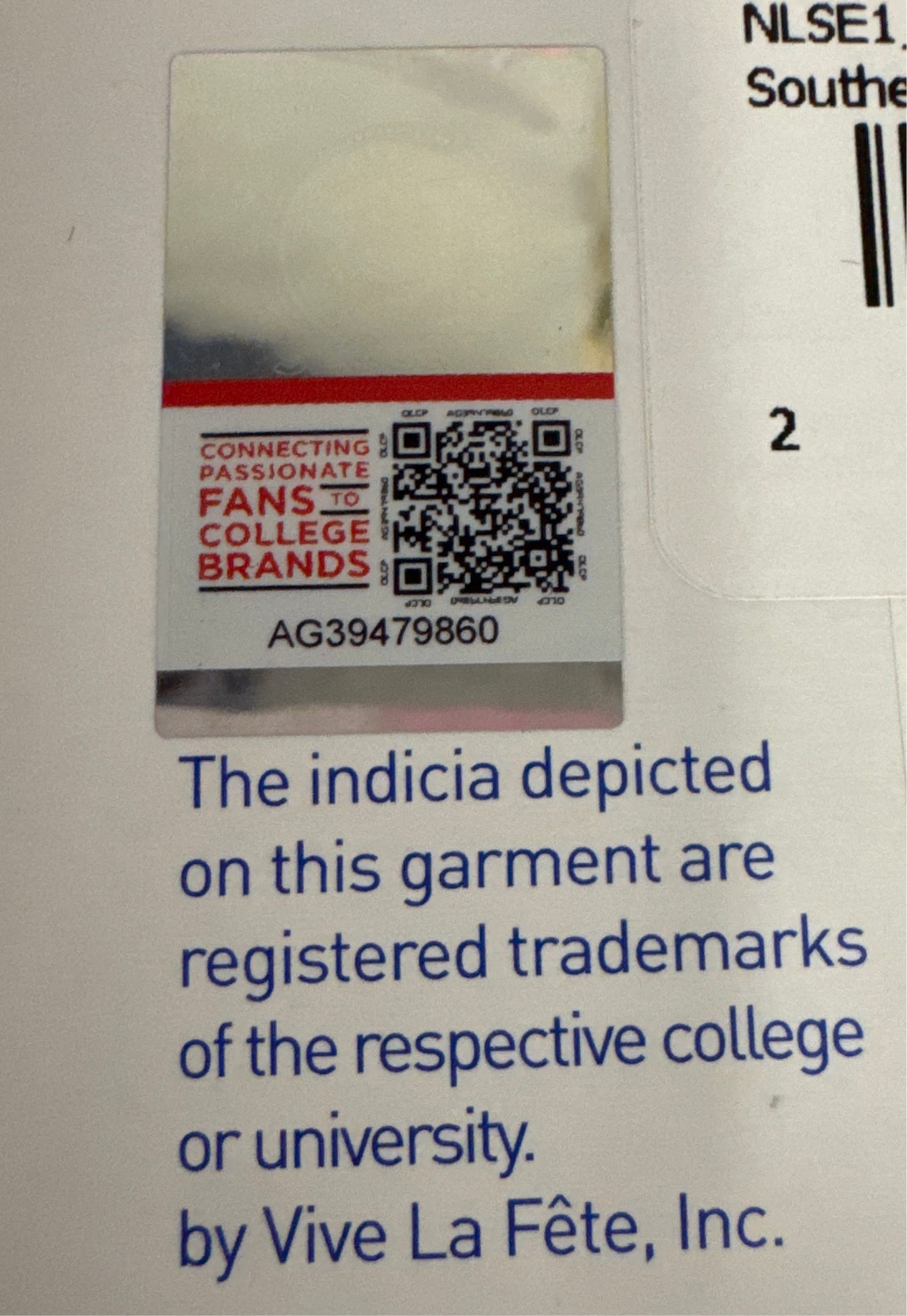 Label with QR code and text on a garment tag, featuring Vive La Fète, Inc.