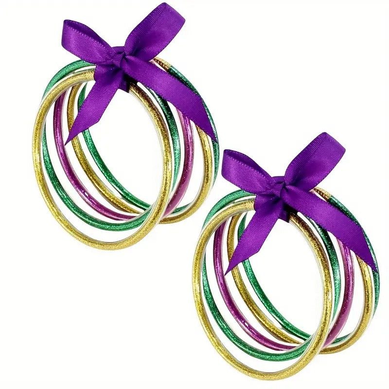 Go Team Bracelet Set with vibrant green, purple, and gold plastic bracelets tied with purple bows for Mardi Gras celebration