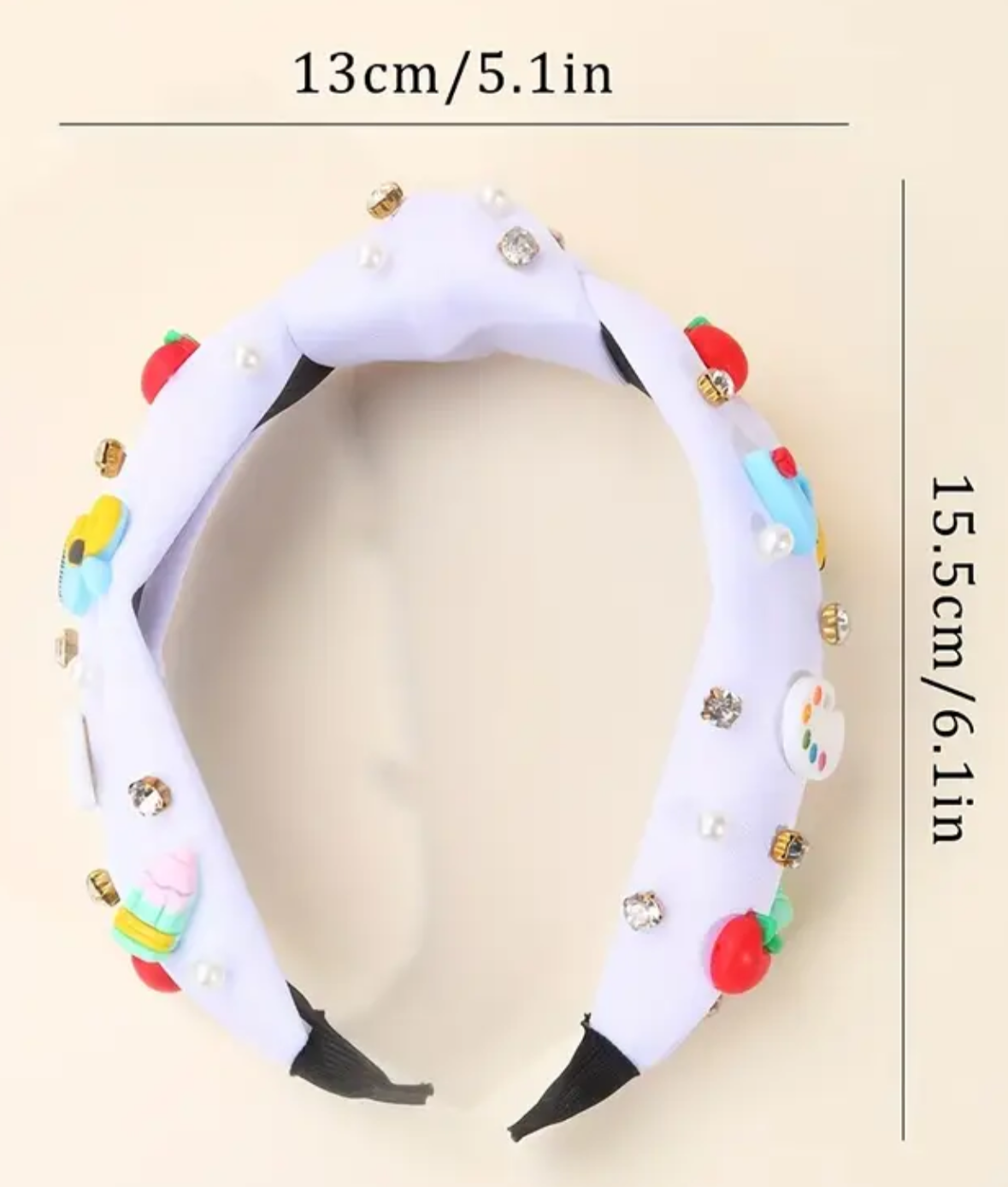 Measurement chart of a colorful headband with dimensions on a beige background