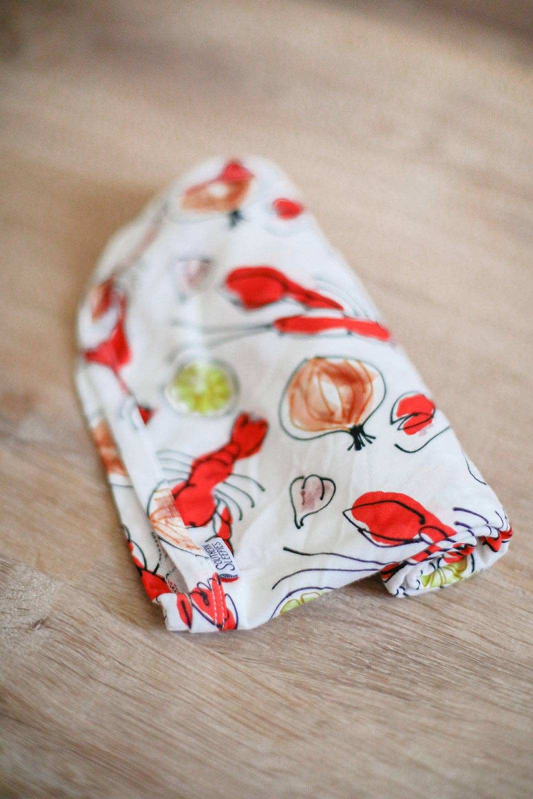 Southern Slumber Crawfish Bamboo Swaddle Blanket with vibrant crawfish pattern.