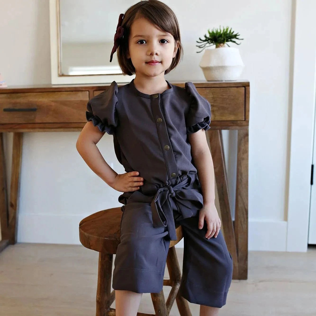 Aster plum romper wide leg and tie waist detail
