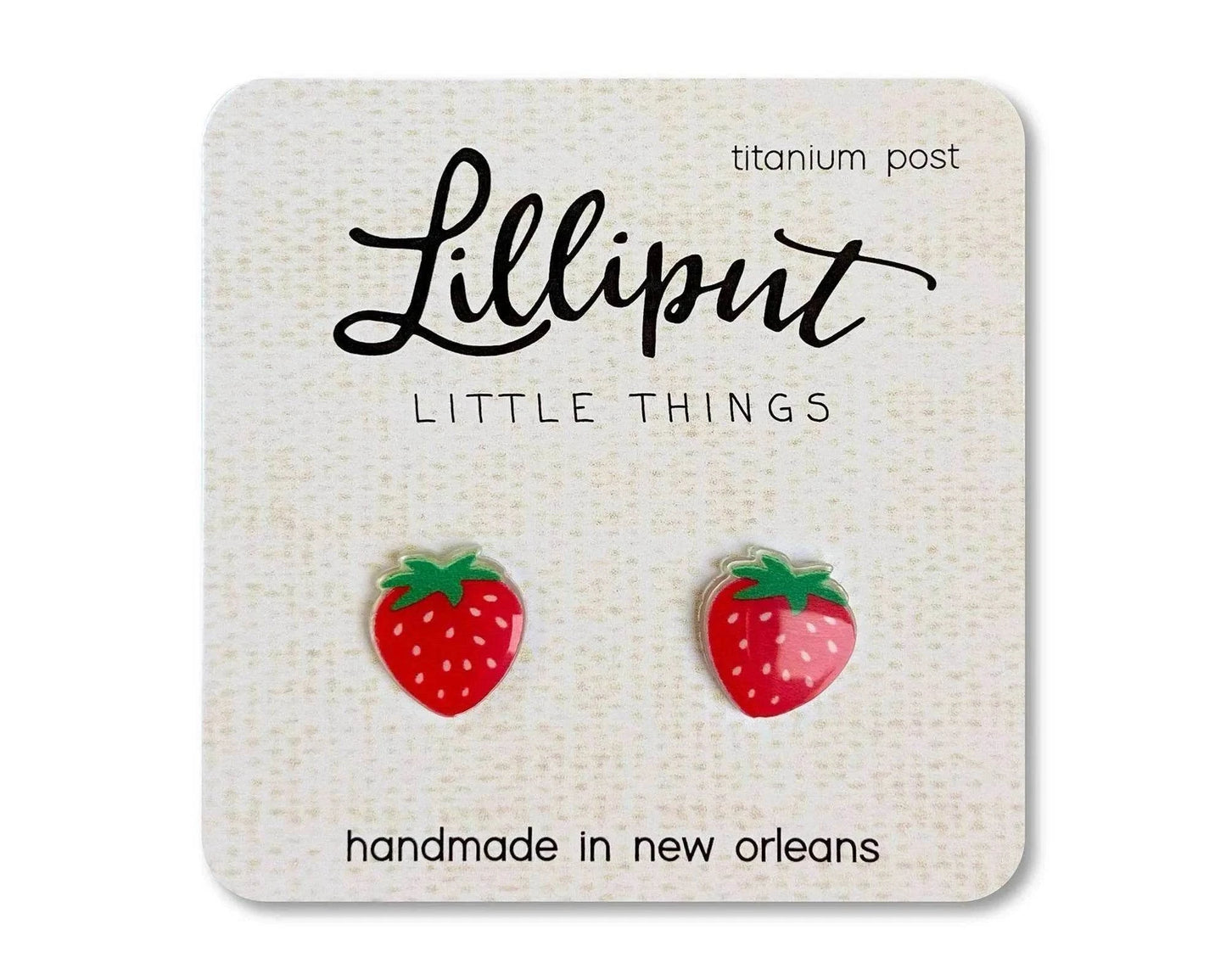 Handmade hypoallergenic titanium strawberry earrings with rubber backs and vibrant UV ink on clear acrylic