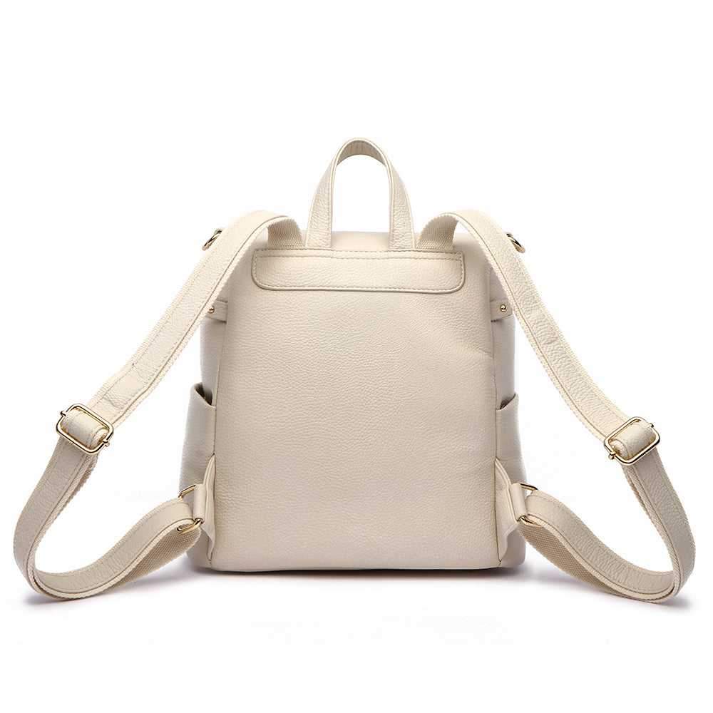 Petit Monaco Diaper Bag in pearl white vegan leather, compact backpack design, adjustable straps.
