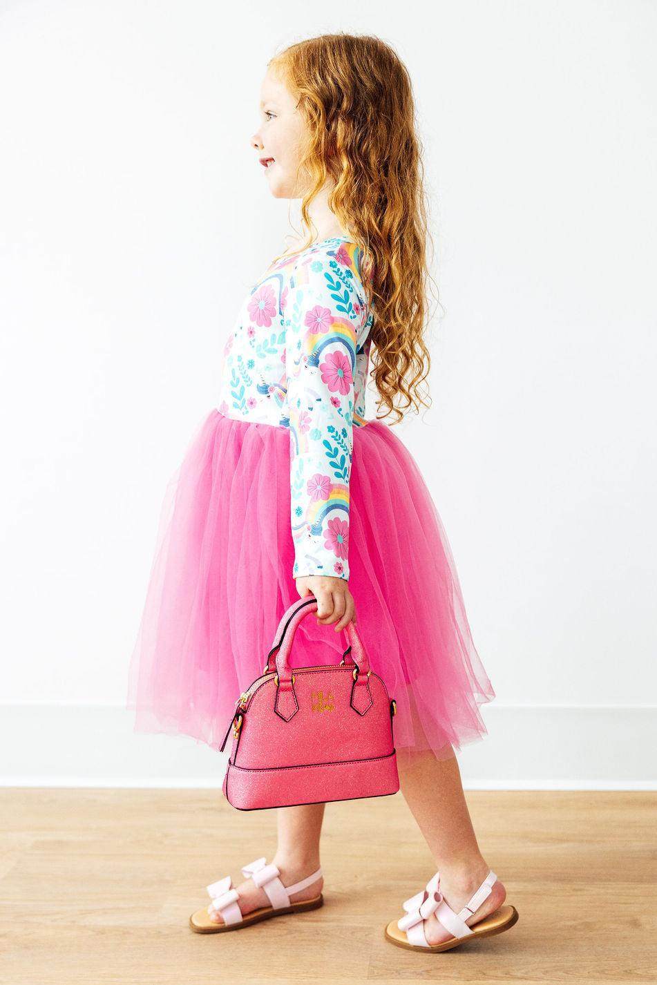 Neon pink glitter crossbody purse strap detail view