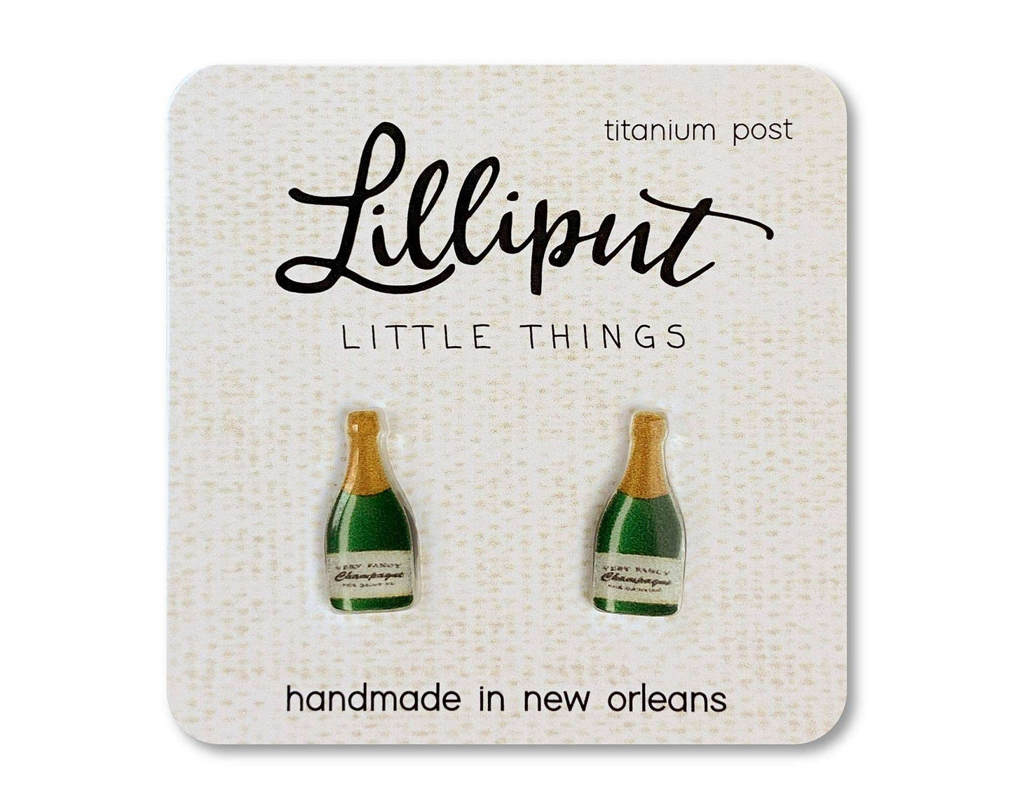 Lilliput Little Things champagne bottle earrings with hypoallergenic titanium posts, waterproof and fade-proof design.