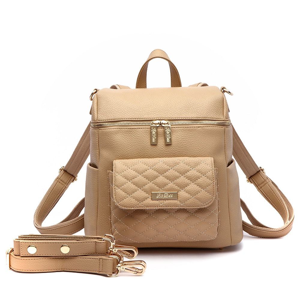 Petite Monaco Diaper Bag in latte vegan leather with quilted front pocket and gold zippers.