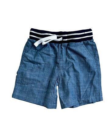 Blue chambray boys shorts with varsity stripe hem and multiple pockets designed for active wear