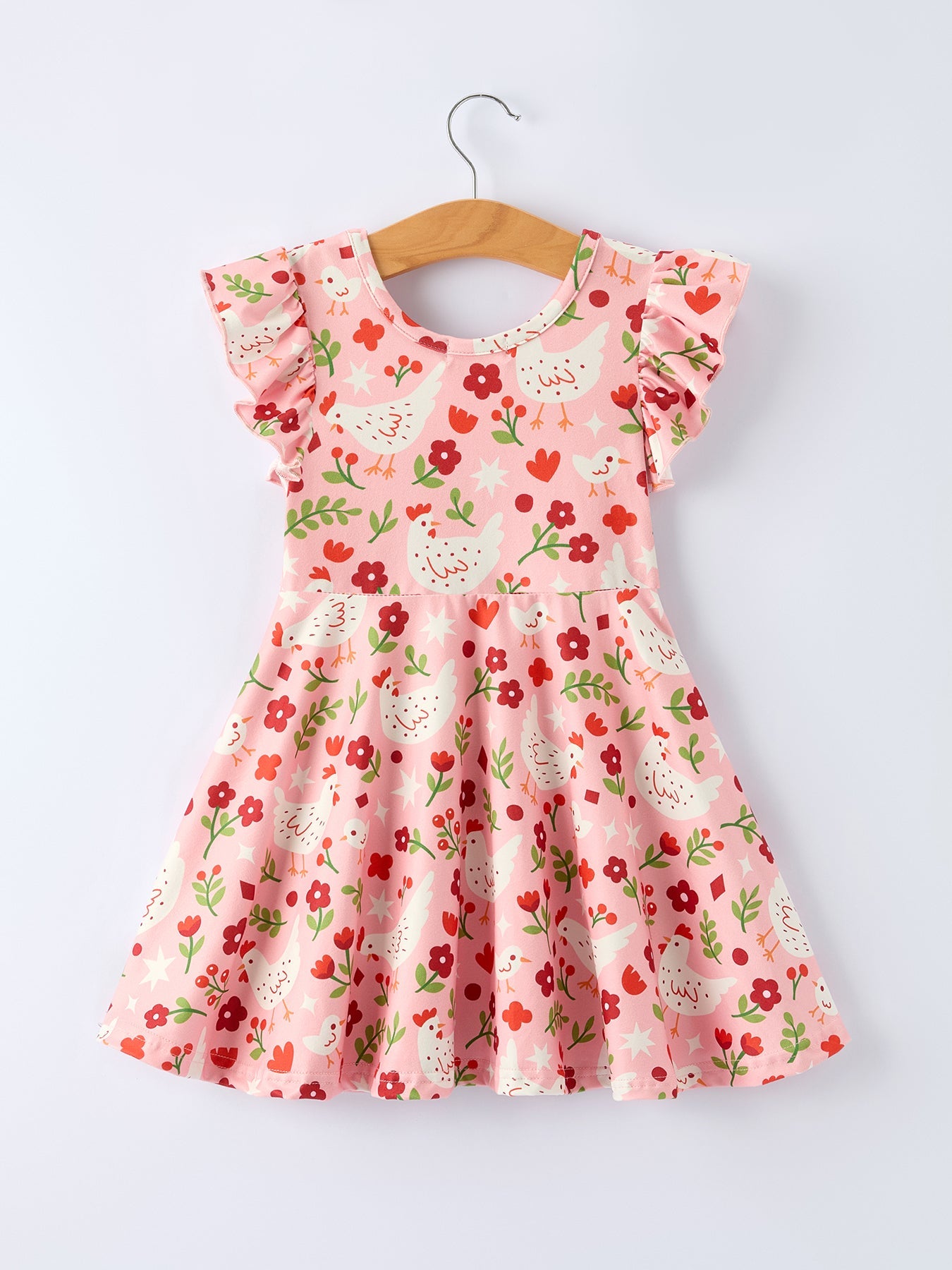 Floral dress on a hanger against a white background
