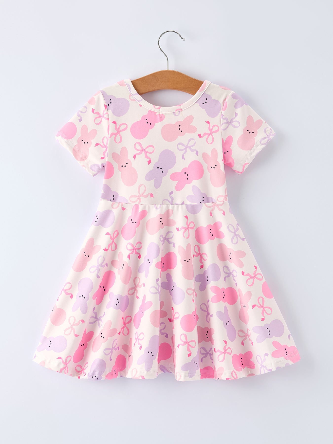 Children's dress with pink and purple butterfly pattern on a white background