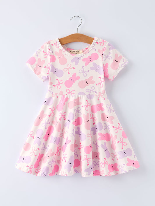 Children's dress with pink and purple floral pattern on a white background