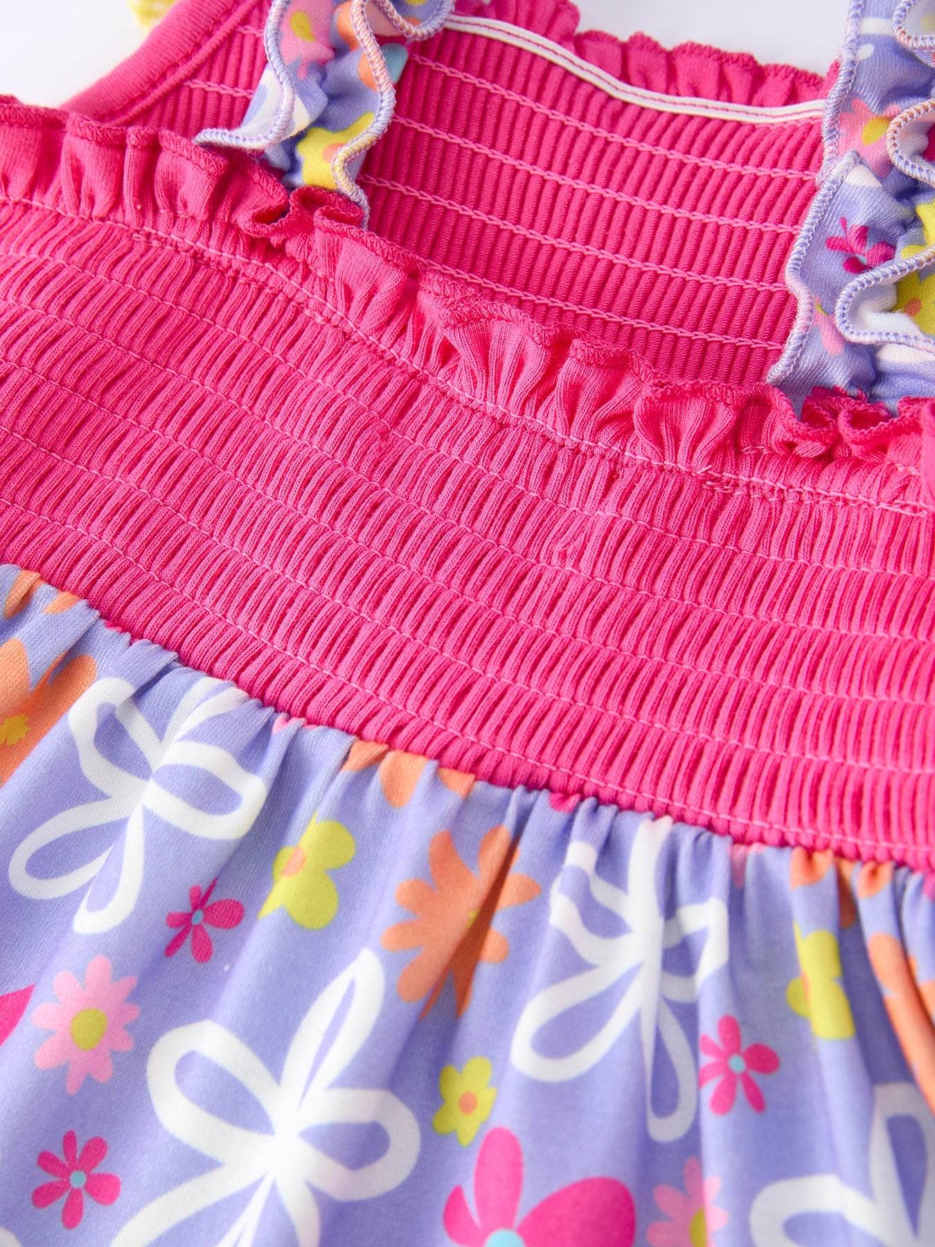 Summer Floral Girls Bow Ruffle Smocked Dress fabric and material close-up
