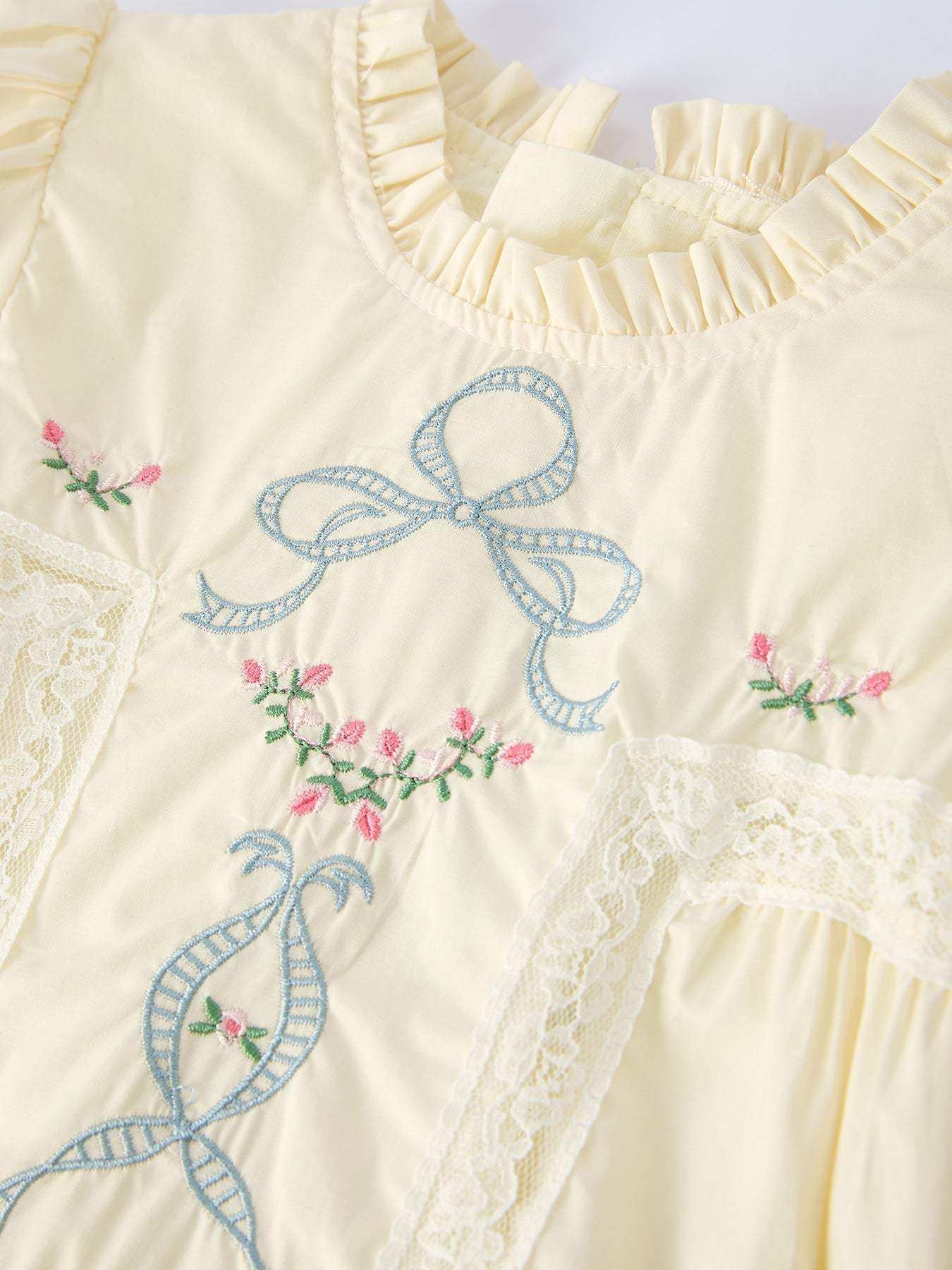 Girl wearing embroidered lace short-sleeved dress