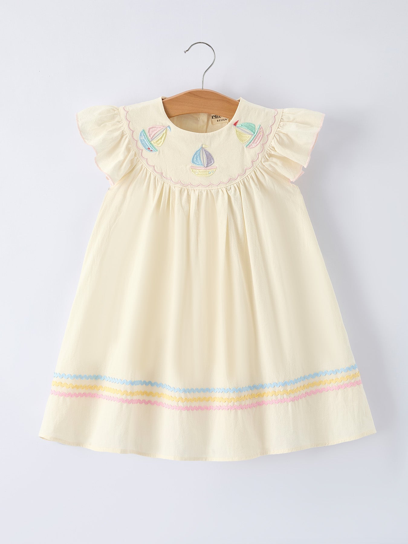 Rainbow sailboat embroidered girls dress front view