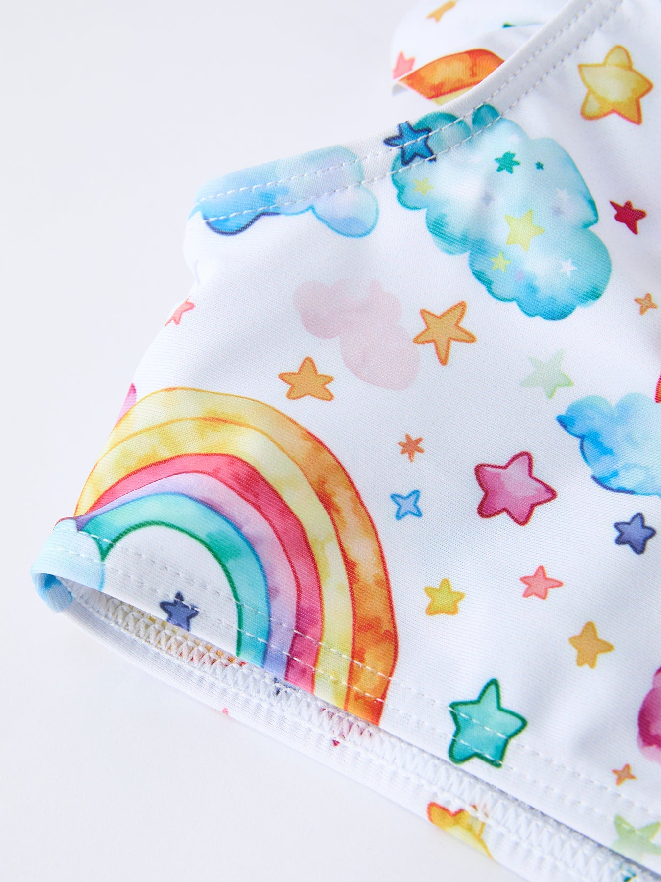 Rainbow print swim set fabric close-up