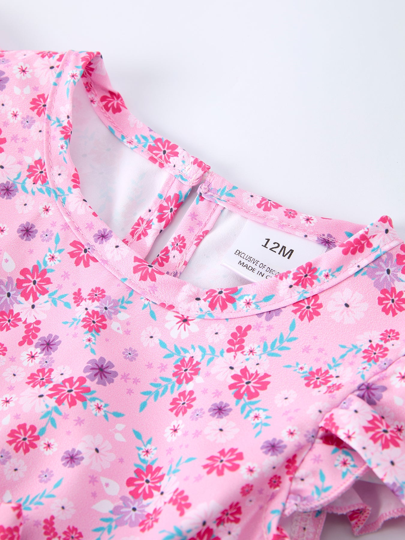 Spring floral baby girls romper side view