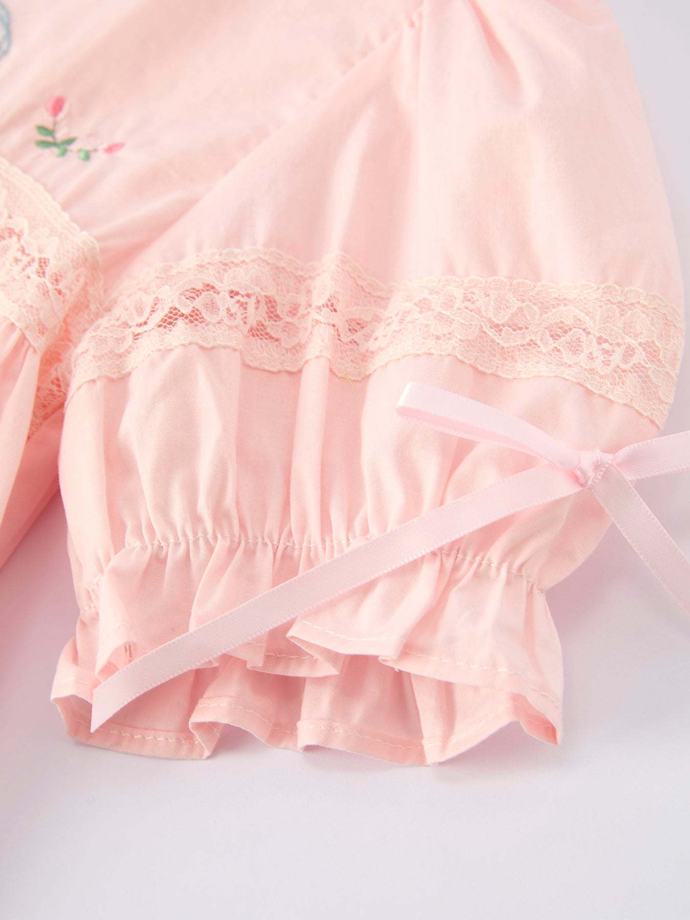 Girls lace dress bodice embroidery close-up
