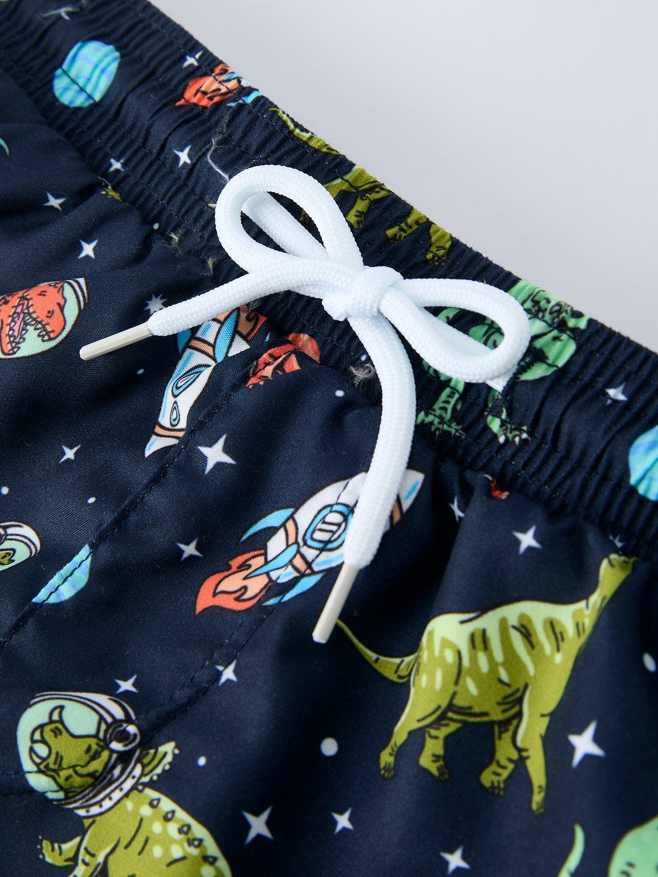 Space dinosaur boys swimsuit back view
