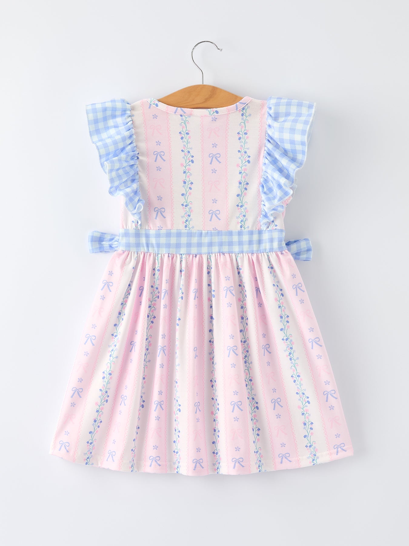 Close-up of smocking detail on plaid girls dress