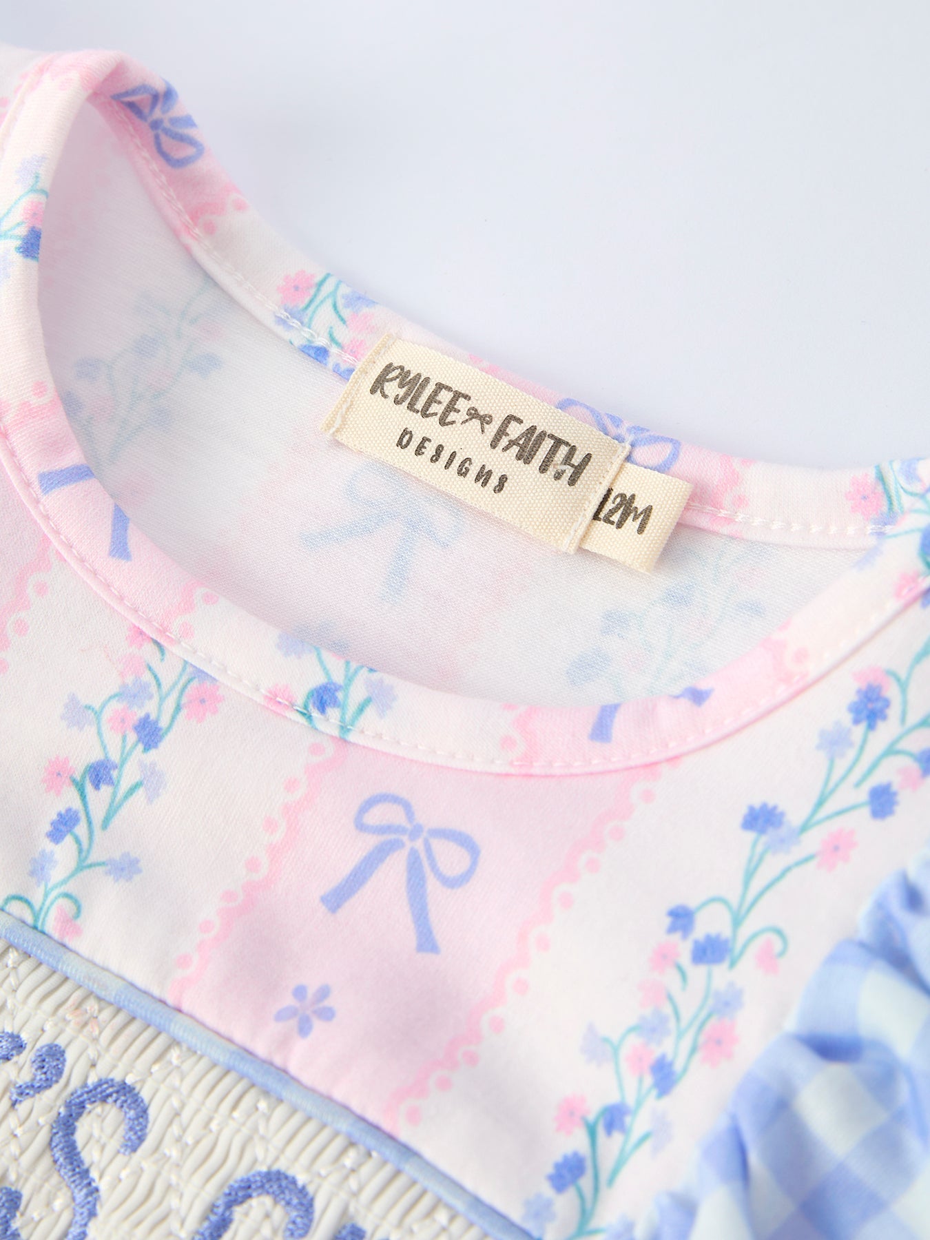 Plaid pattern close-up on baby girls romper