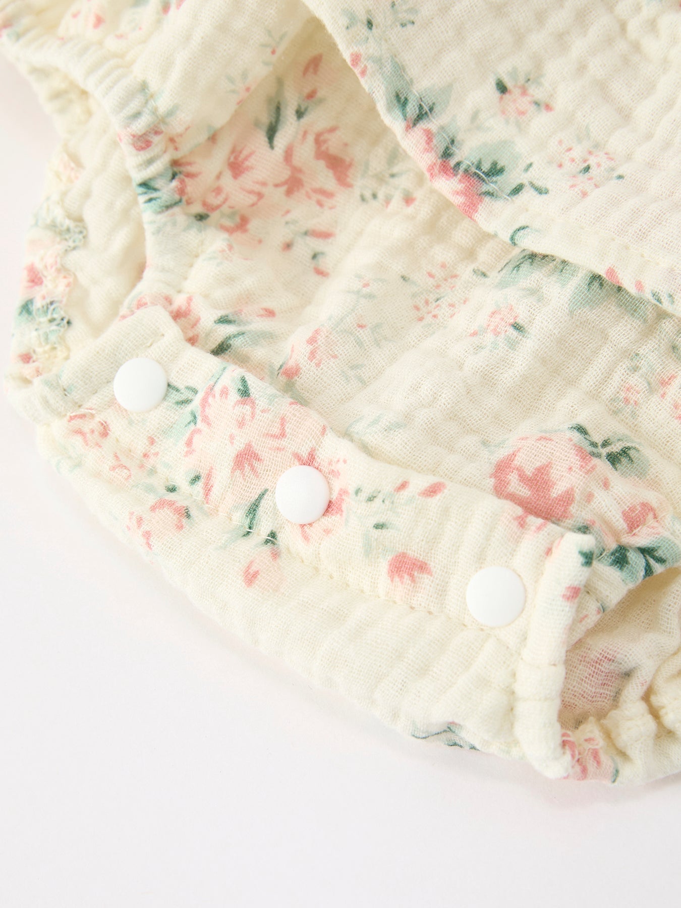 Summer floral romper and hat side view
