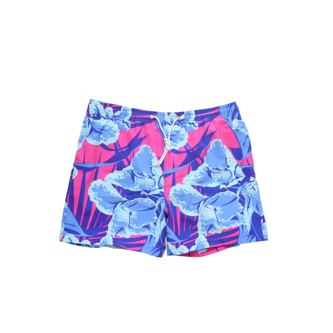 Bright fuchsia Kokomo Trunks with blue Hawaiian flower print, elastic waist, and contrast drawstring.