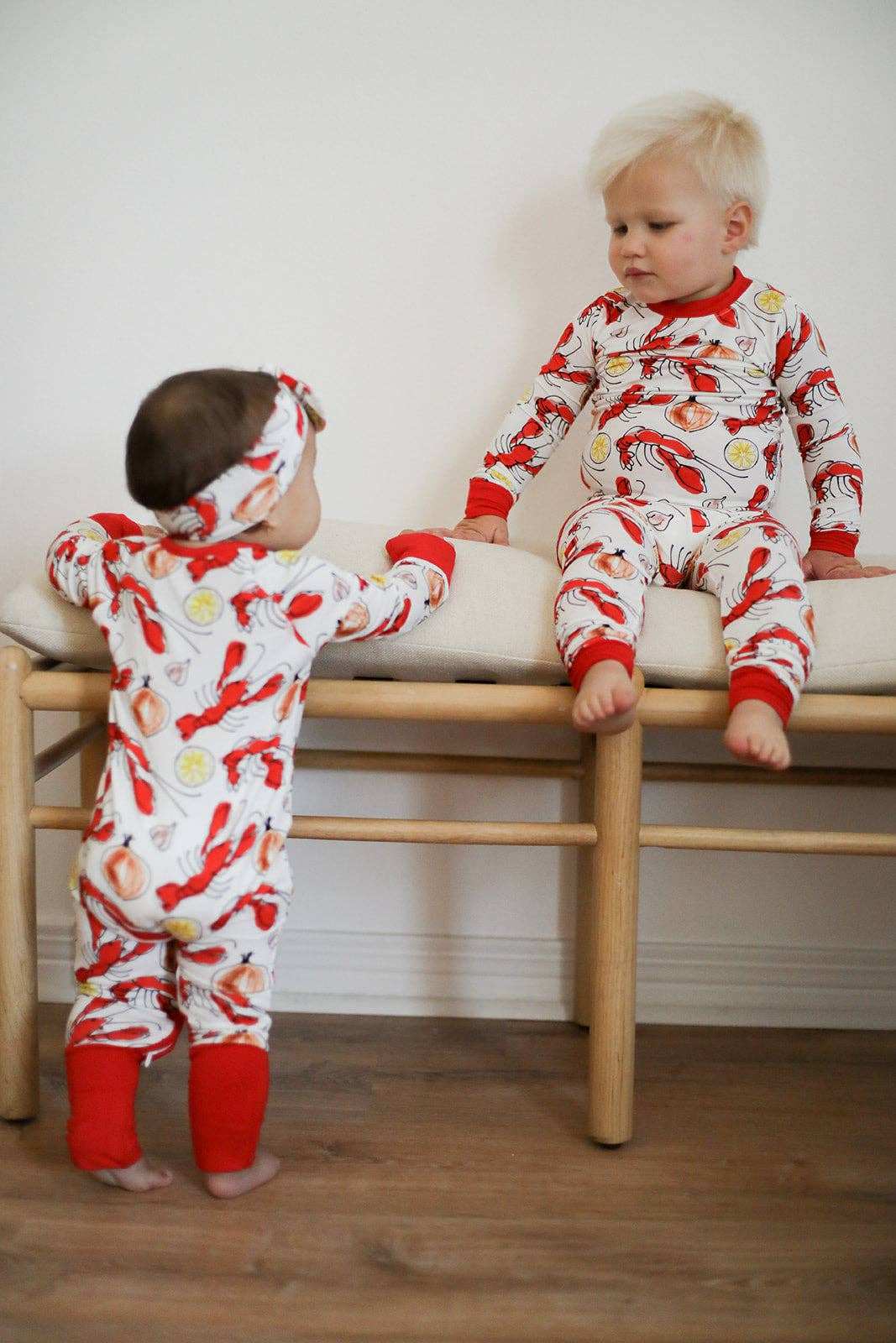 child wearing crawfish pattern pajamas