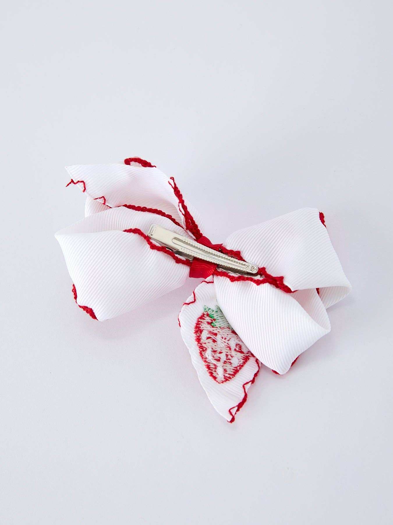 Strawberry embroidered white girls hair bow, side view