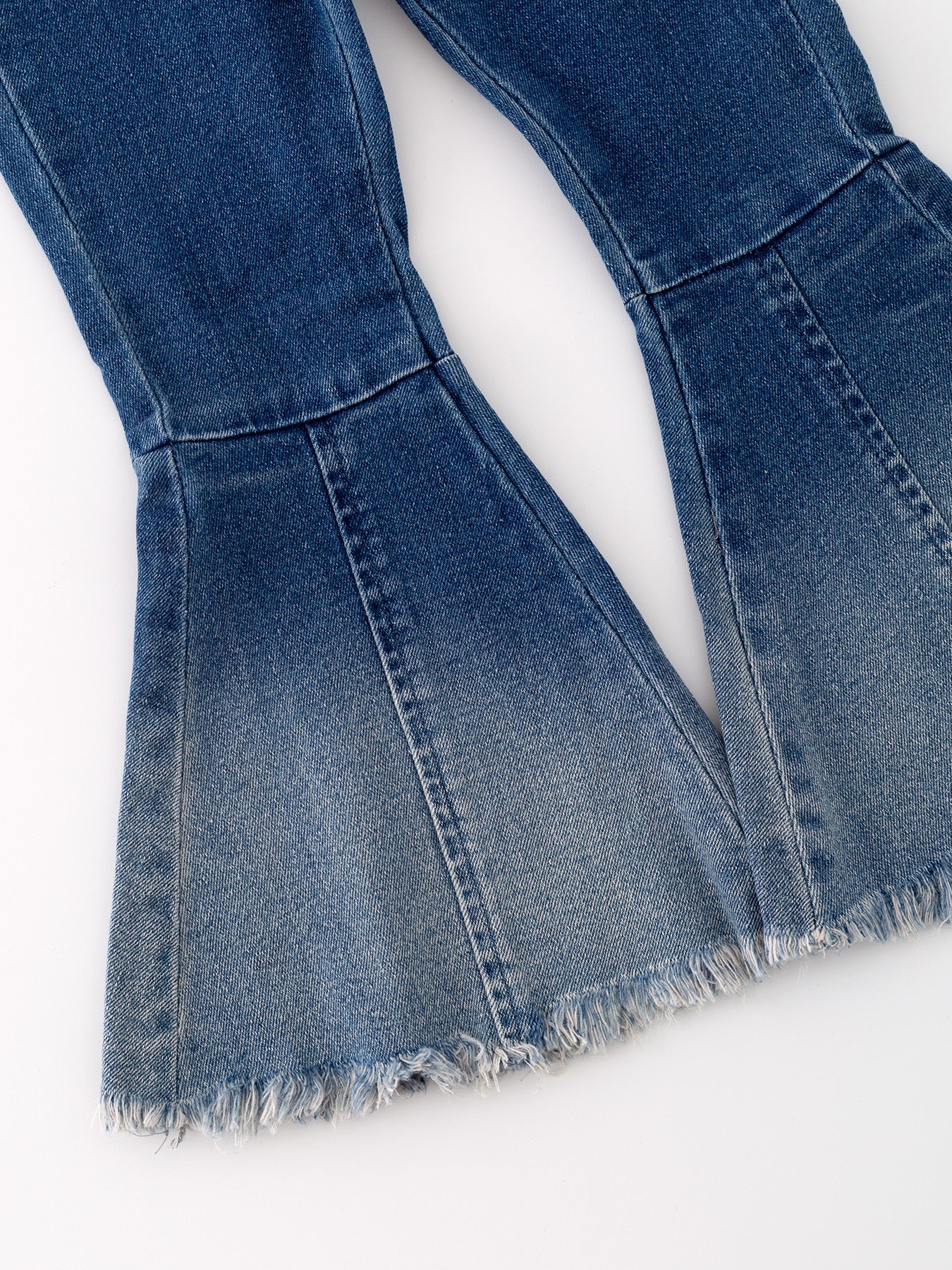 Deep blue spray dye denim jeans back view
