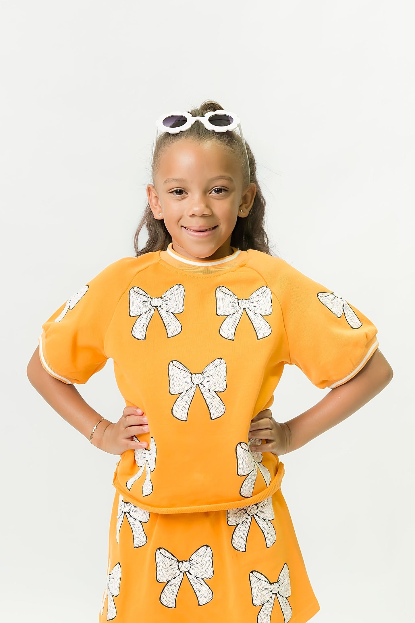 Orange and White Bows Top for kids with playful bow designs and vibrant orange color