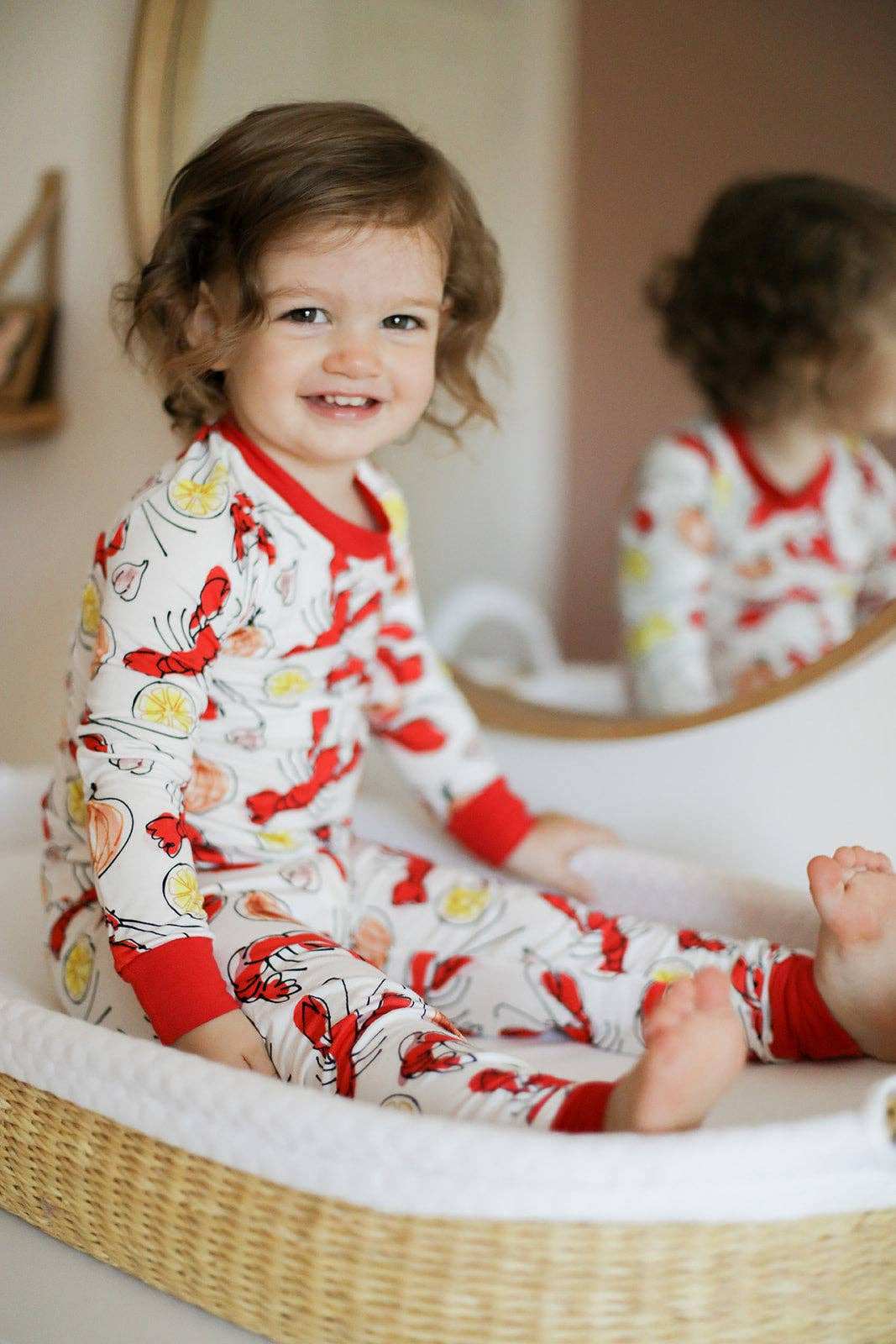 child wearing crawfish pattern pajamas