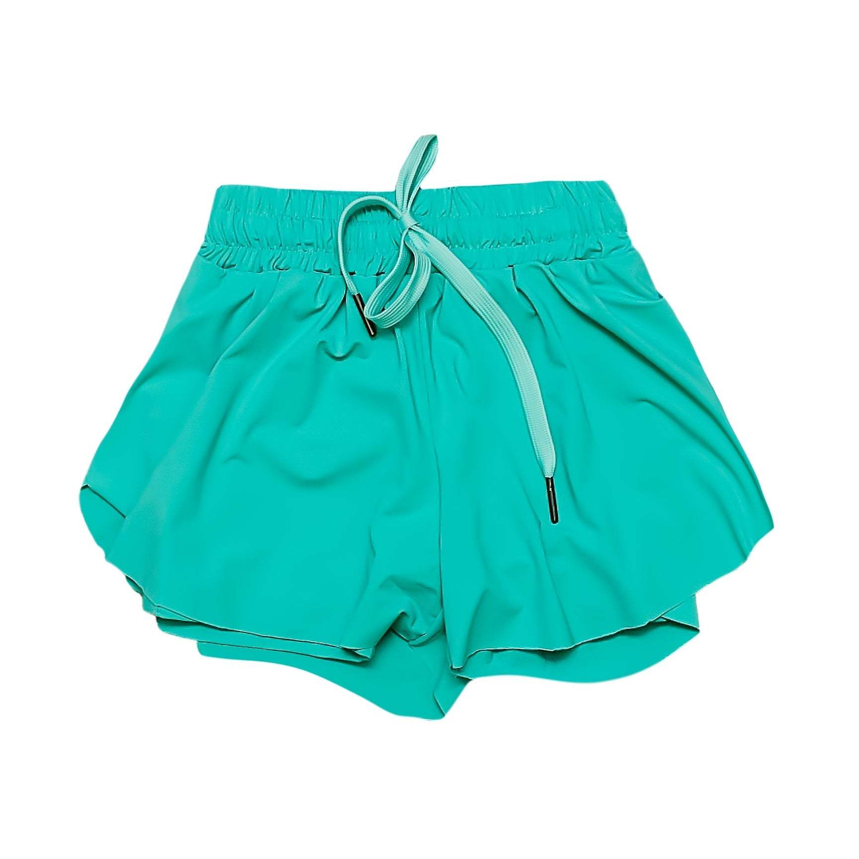 Child wearing teal butterfly shorts outdoors