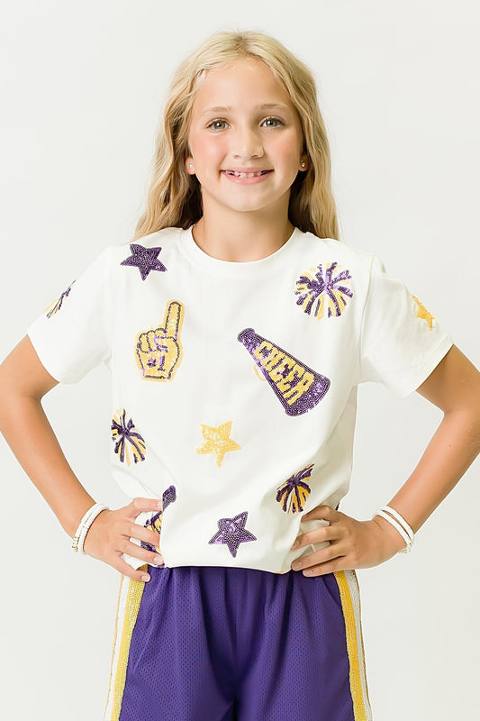 Girl wearing white Purple and Yellow Cheer Shirt with cheer-themed patches and purple shorts