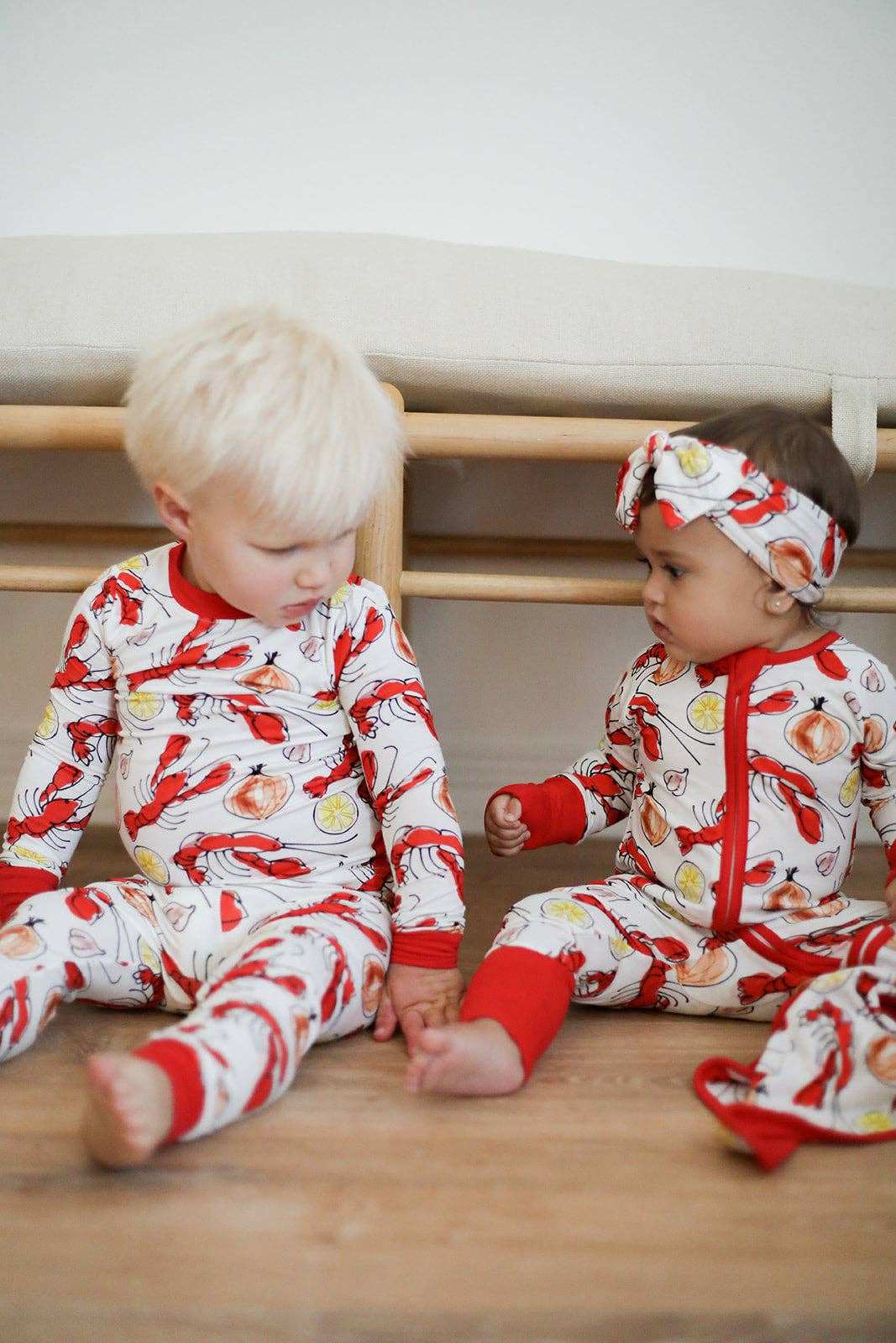 child wearing crawfish pattern pajamas