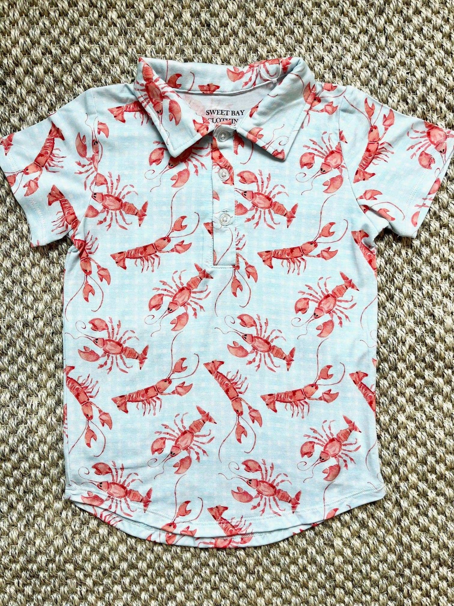 Sweet Bay Clothing Crawfish Polo Shirt with watercolor crawfish design.