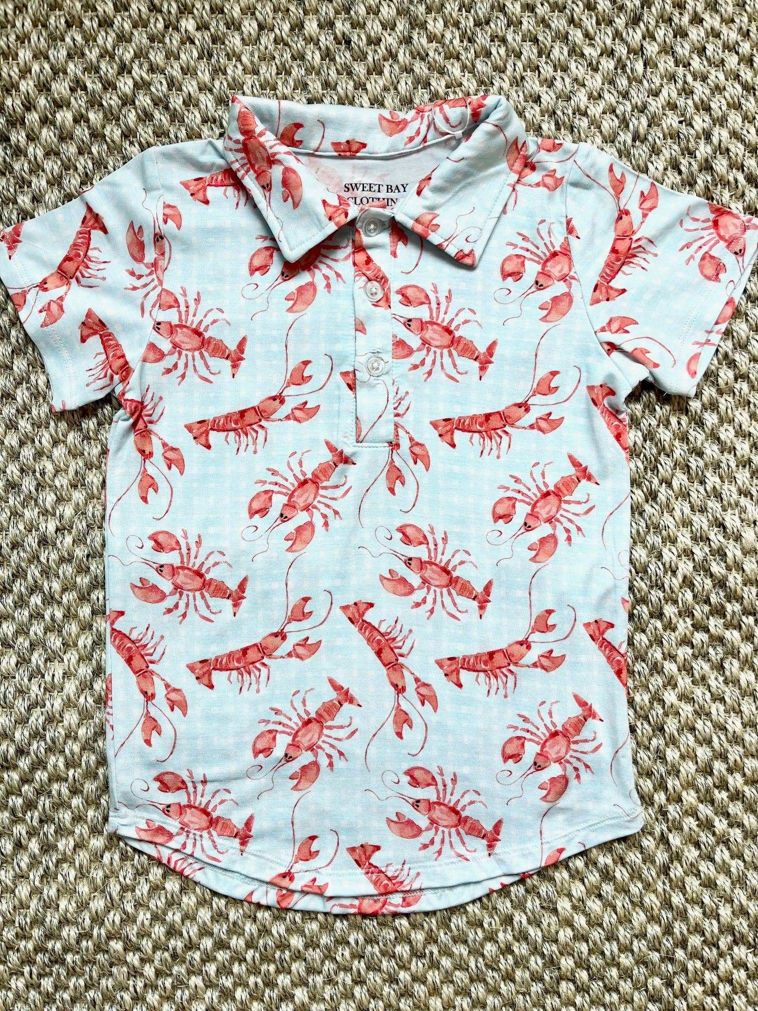 Sweet Bay Clothing Crawfish Polo Shirt with watercolor crawfish design.