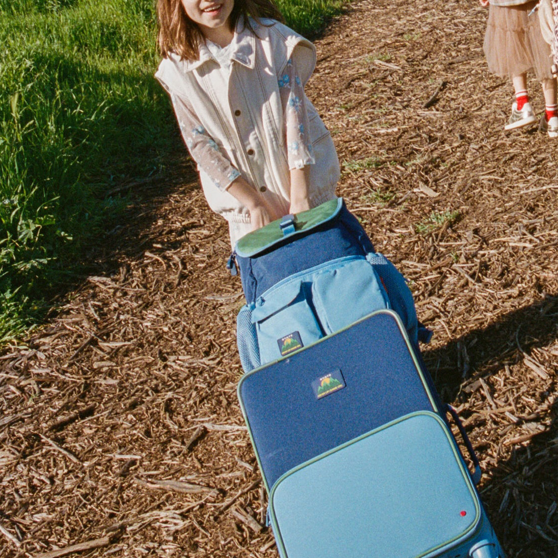 Logan Carry-On Suitcase in Green/Blue/Orange, back view