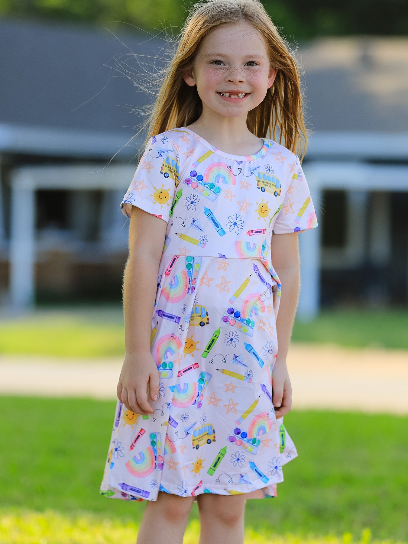 Back view of colorful back-to-school girls dress