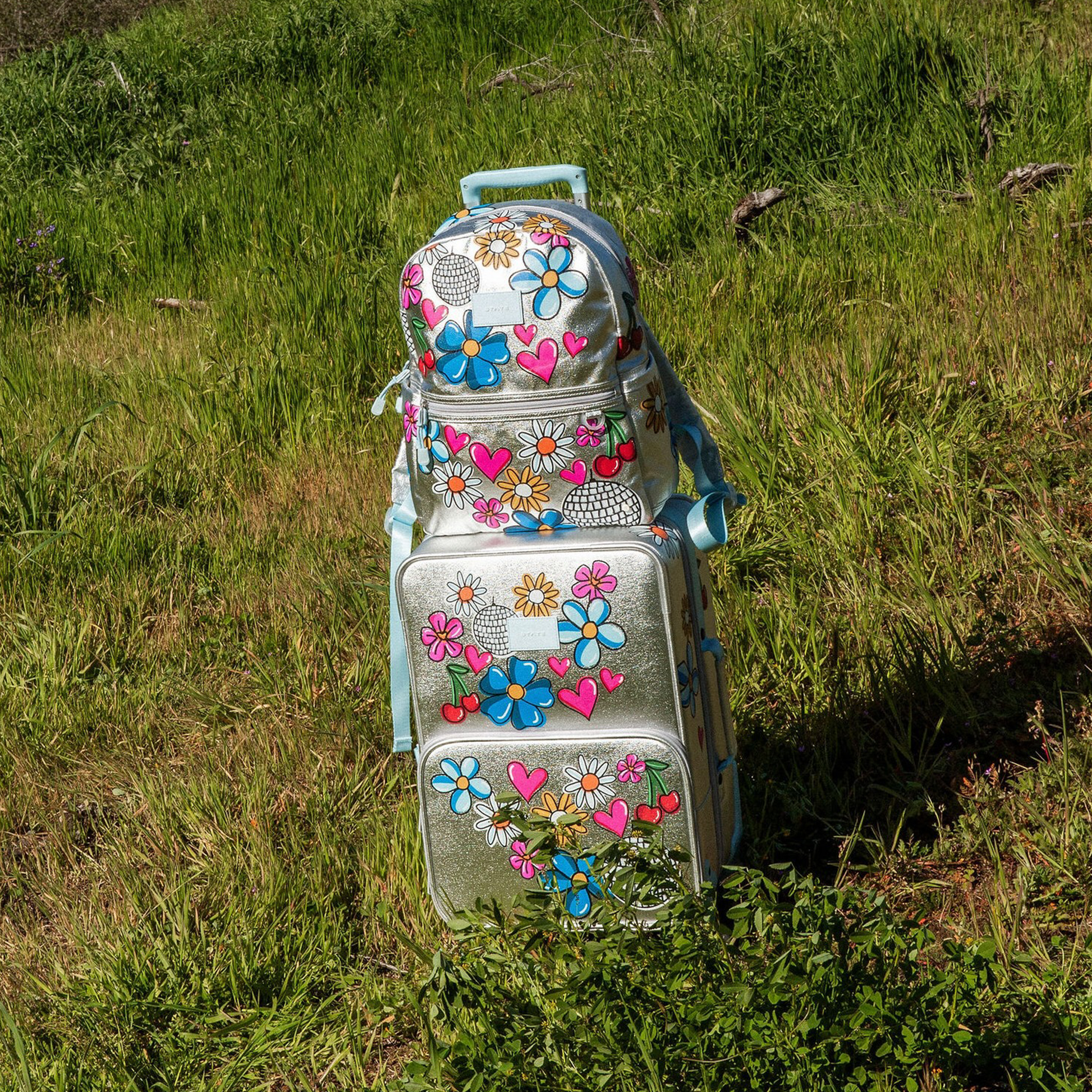 Logan Carry-On Suitcase in Graffiti, wheels and handle detail