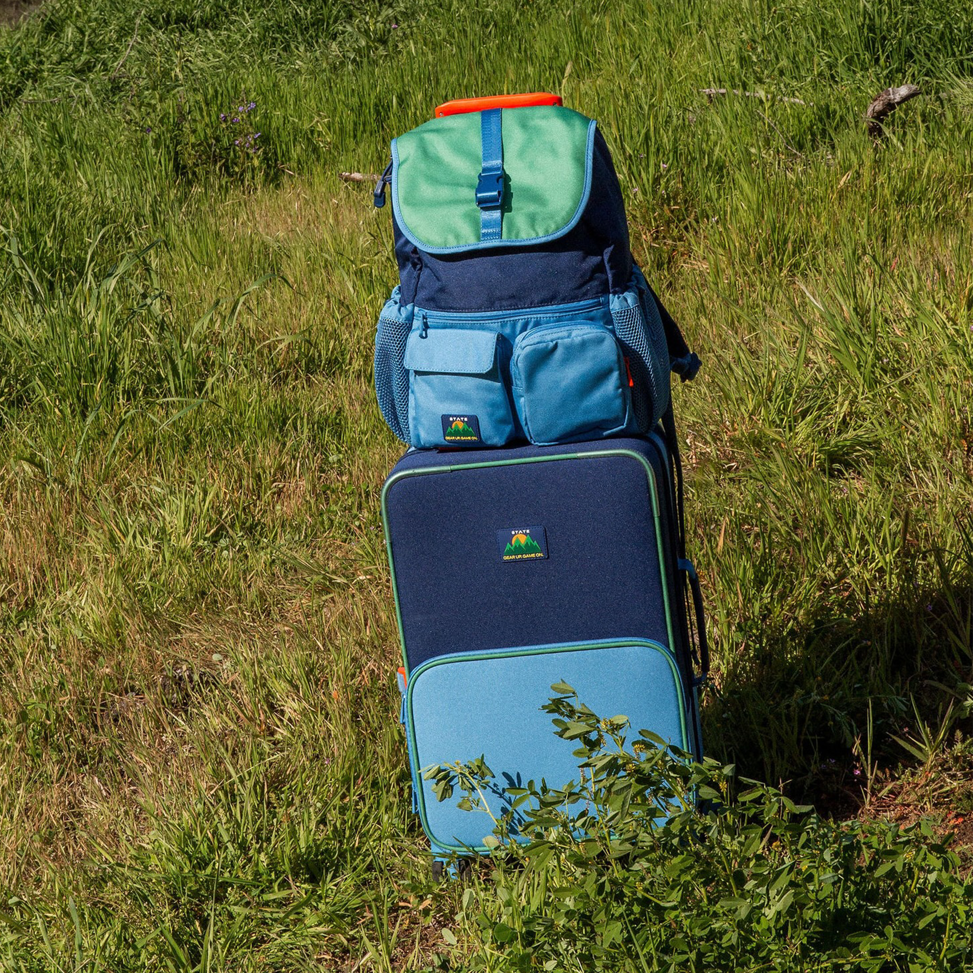 Logan Carry-On Suitcase in Green/Blue/Orange, wheels and handle detail