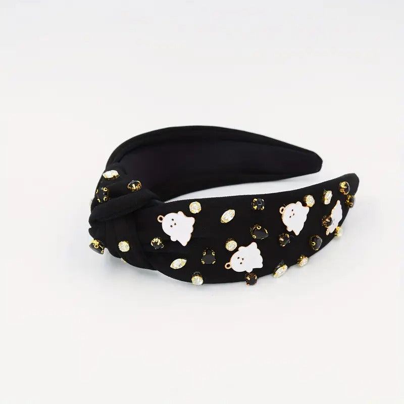 Black knotted headband with white ghost prints and sparkling jewel accents for a spooky look