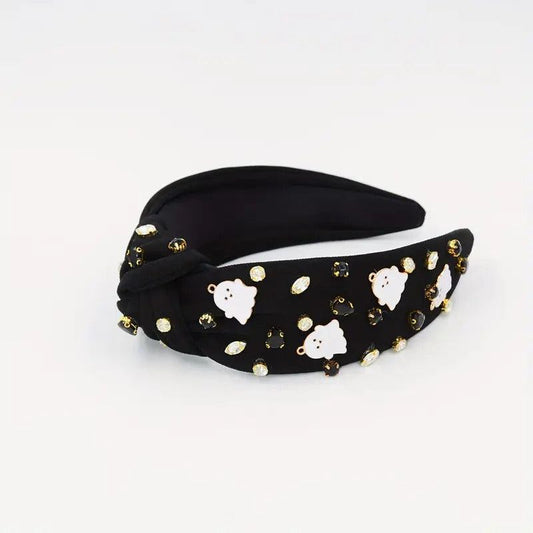 Black knotted headband with white ghost prints and sparkling jewel accents for a spooky look