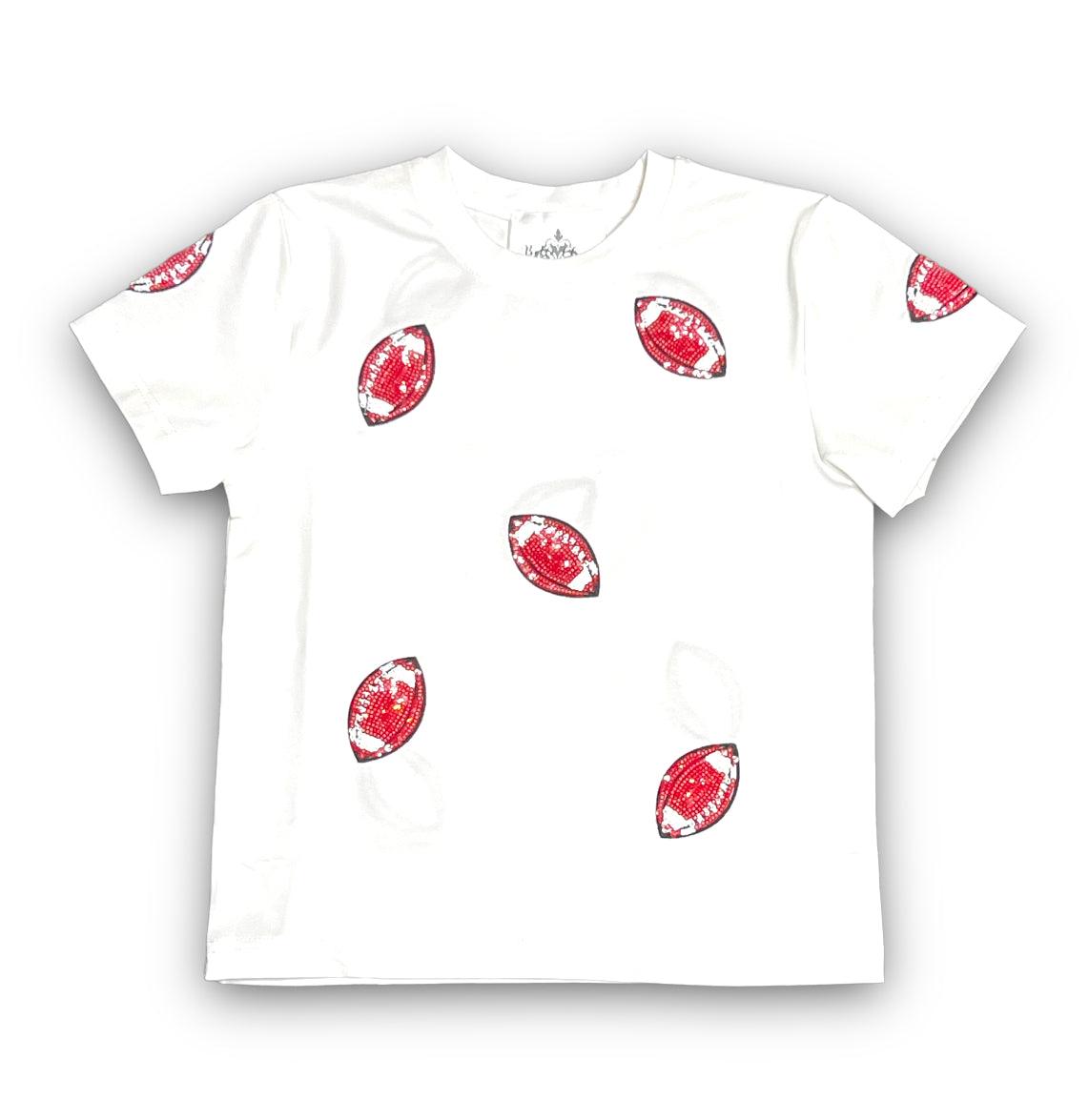 White shirt with red matte football sequins scattered on front and sleeves