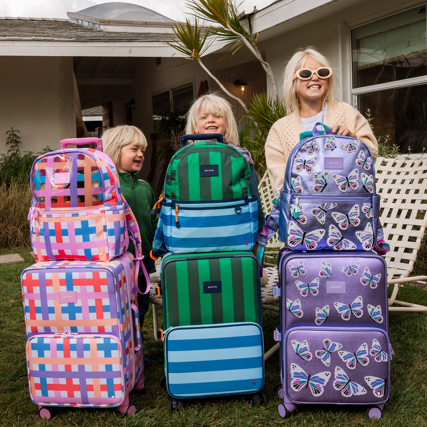 Logan Carry-On Suitcase in Butterfly, wheels and handle detail