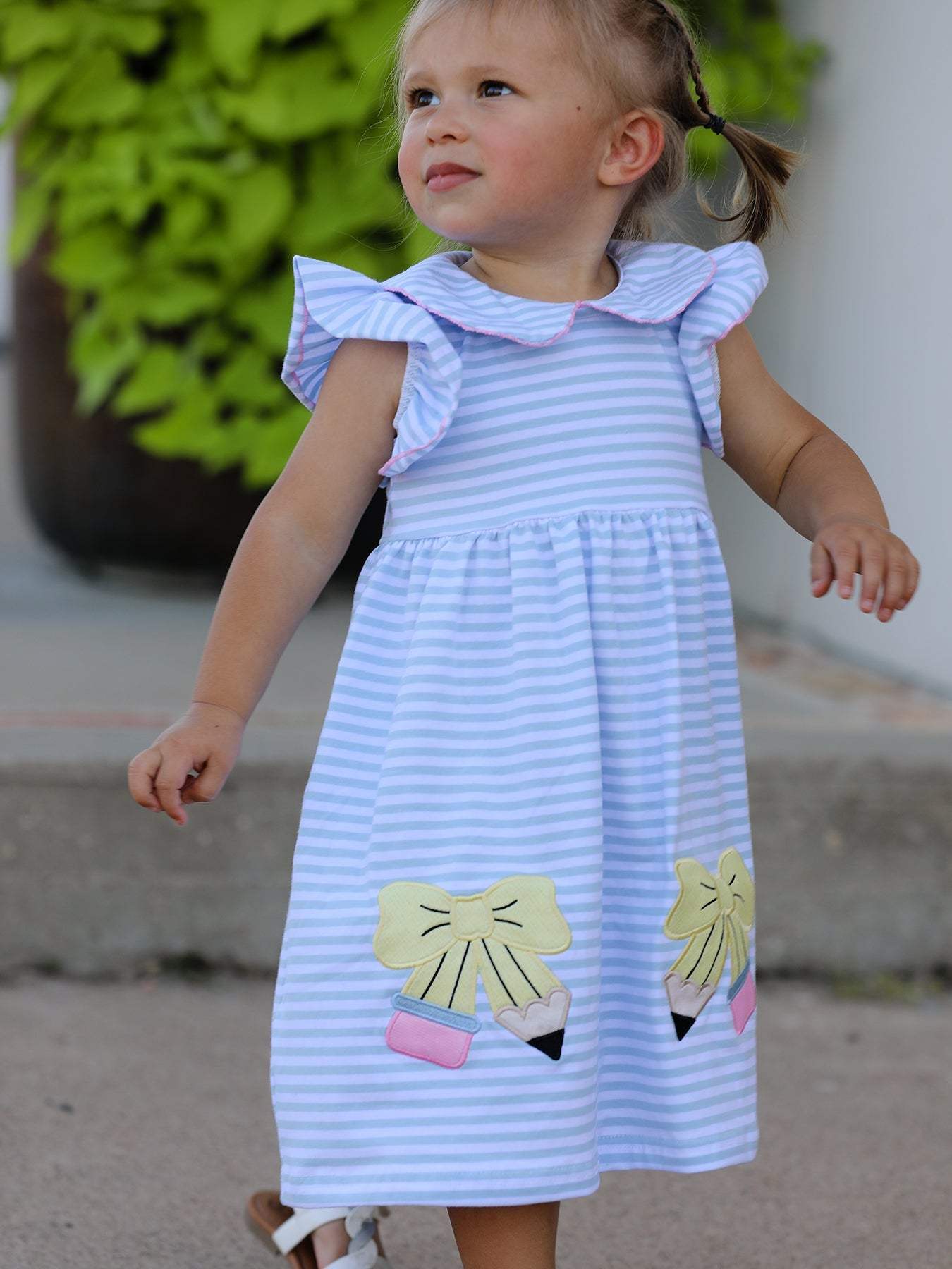 Back to school girls stripe dress with pencil appliqué and bow, front view